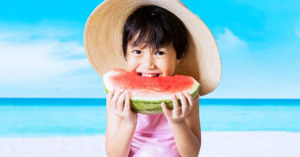kid doing watermelon birthday shoot