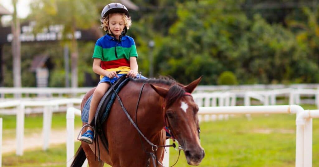 kid riding the horse